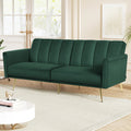 Green velvet sofa in bright living room with natural light from windows on wooden floor