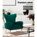 Green velvet wingback armchair with gold legs in living room, 