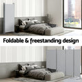 Grey 4-panel room divider foldable freestanding design showing single panel and folded zigzag in bedroom