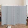 Grey 4-panel room divider zigzag configuration in living room lifestyle with open book on floor lamp and vase on sides