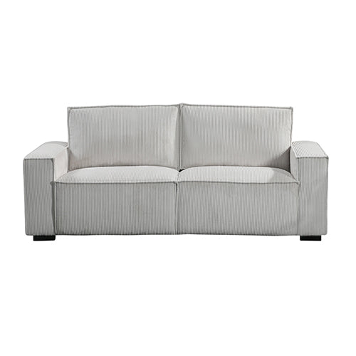 Light grey corduroy 3-seater sofa in living room with abstract artwork and coffee table