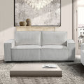 Light grey corduroy 3-seater sofa in living room with abstract artwork and coffee table
