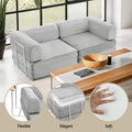 Grey corduroy folding sofa bed in living room with feature callouts for flexible design, elegant look and soft feel