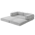 Grey corduroy folding sofa bed extended: three-section mattress, back cushions and chrome handles, white background