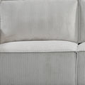 Close-up of back cushion on light grey corduroy sofa showing vertical ribbed texture