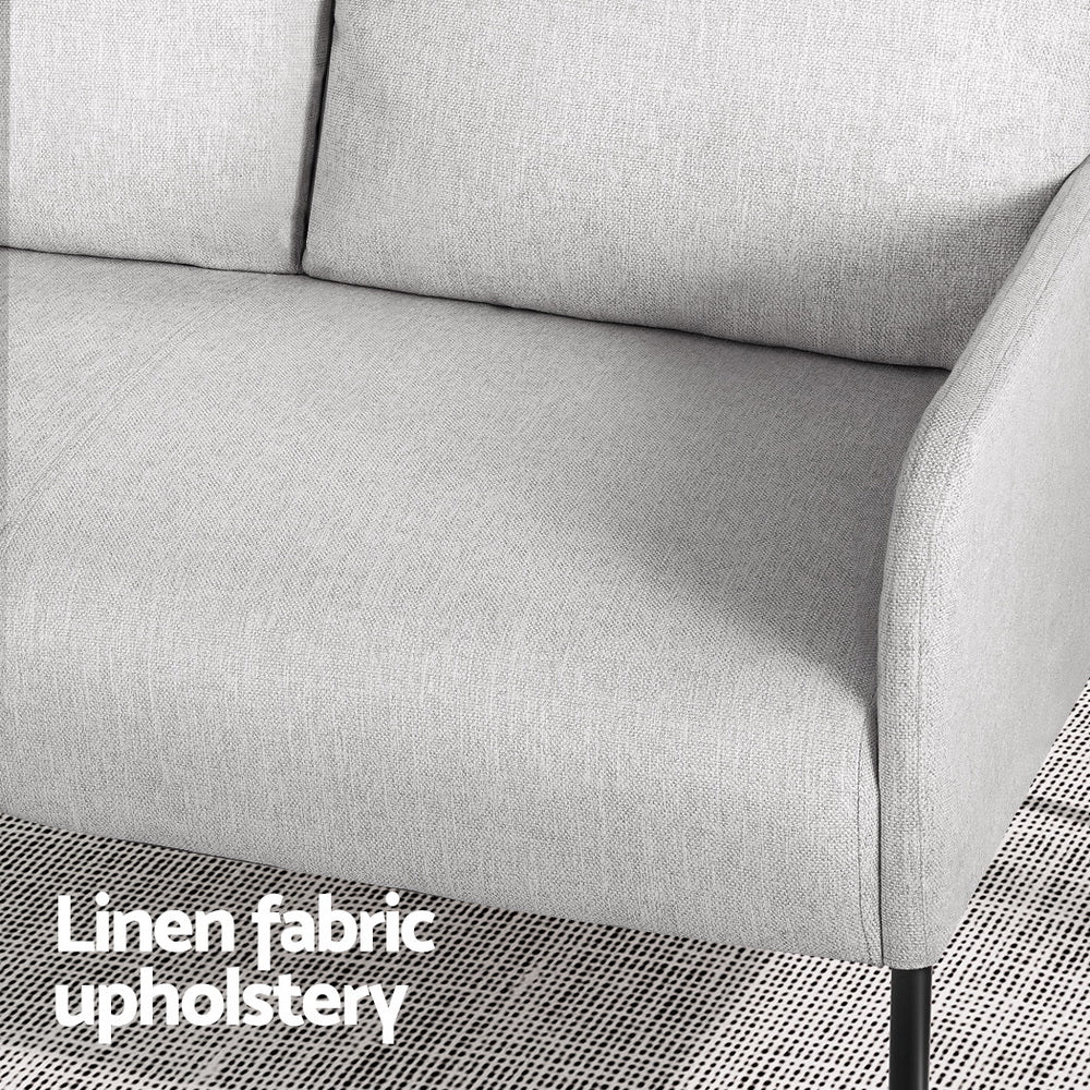 Close-up of light grey 2-seater sofa armrest and seat showing linen fabric texture, "Linen fabric upholstery" text