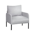 Light grey fabric armchair with cushioned back, padded seat and black metal cylindrical legs, angle view on white background
