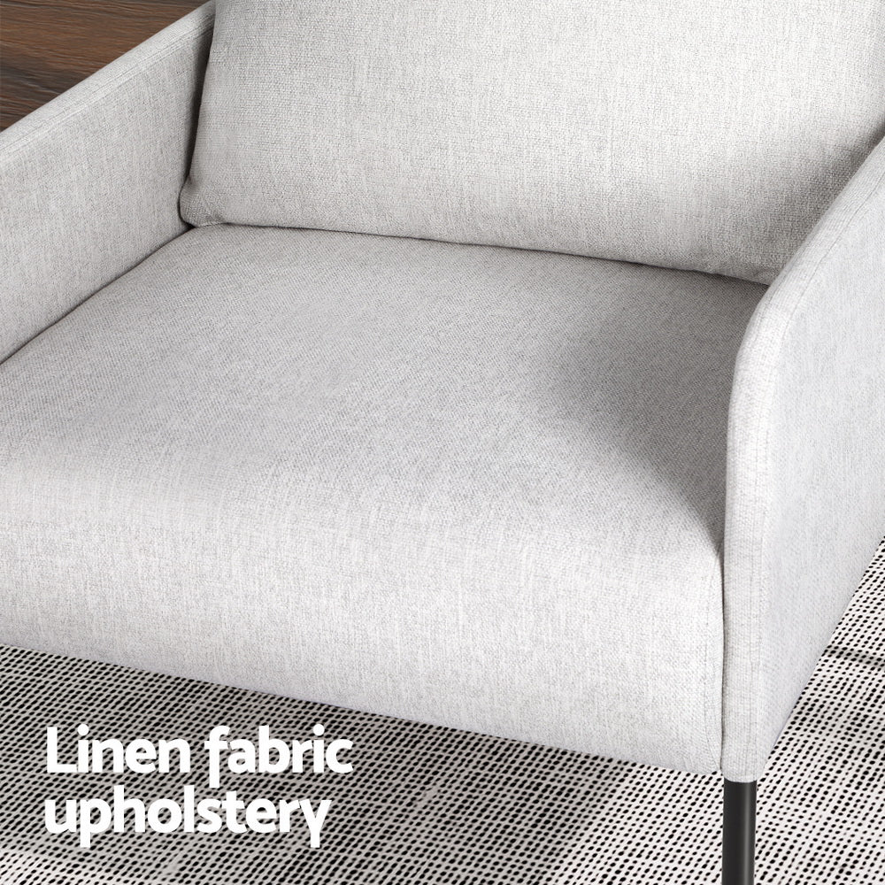 Close-up of grey linen fabric armchair seat and cushioned back with "Linen fabric upholstery" text and black metal legs