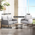Grey fabric chair (150kg) and matching 2-seater sofa (250kg) in living room scene with oval coffee table and tree