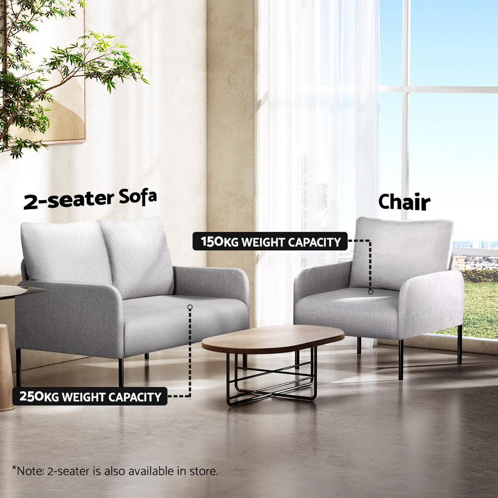 Grey fabric chair (150kg) and matching 2-seater sofa (250kg) in living room scene with oval coffee table and tree
