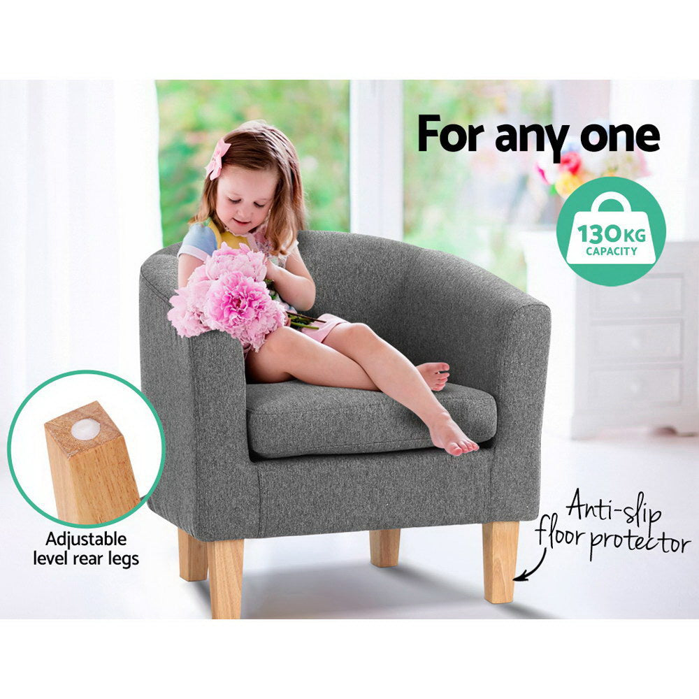 Child in grey fabric barrel armchair holding pink flowers, badges: 130KG capacity, Anti-slip floor protector, adjustable legs