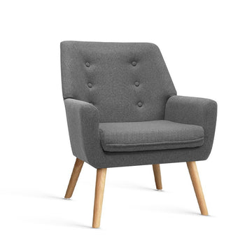 Grey fabric button-tufted armchair with wood splayed legs, five-button backrest, three-quarter view on white background