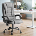 Grey fabric massage office chair in lifestyle home office setting with white desk and bookshelf
