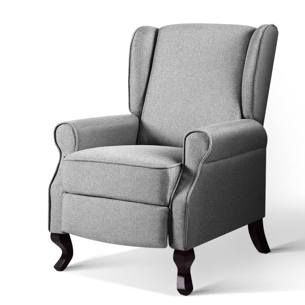 Grey fabric wingback recliner armchair with rolled arms and dark wood cabriole legs, angle view on white background