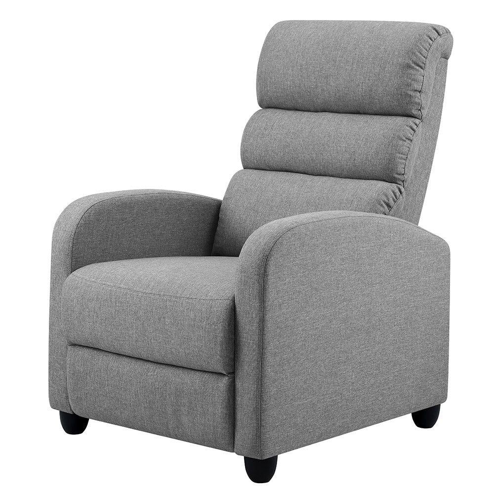 Grey fabric recliner chair with segmented padded back, rounded arms and black bun feet, angle view on white background