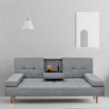Grey fabric sofa bed in minimal room with centre cup holder tray open holding iced drink and water bottle