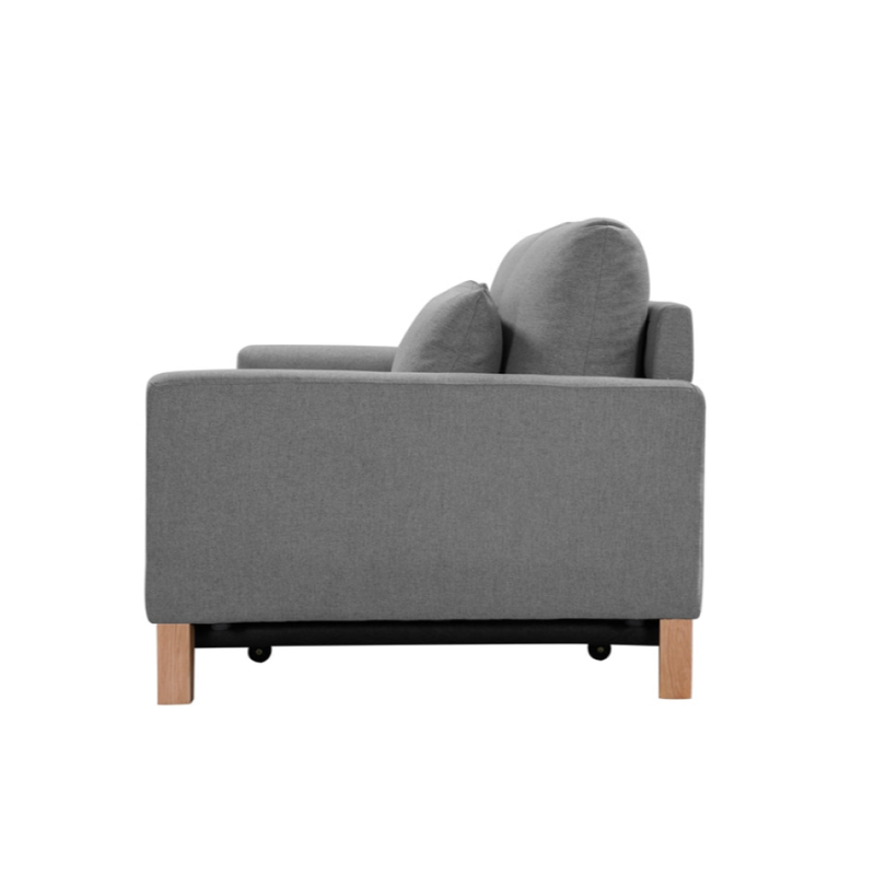 Side view of grey fabric sofa bed with scatter pillow and square track arms on white background