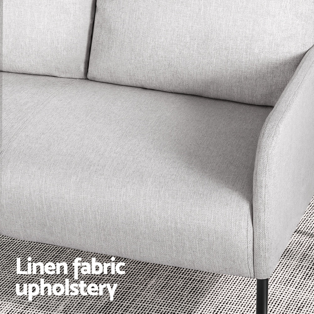 Grey linen fabric sofa seat and armrest close-up with "Linen fabric upholstery" text overlay, woven rug at bottom edge