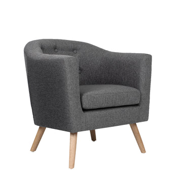 Grey fabric tub armchair with button-tufted back and natural wood tapered legs, angle view on white background