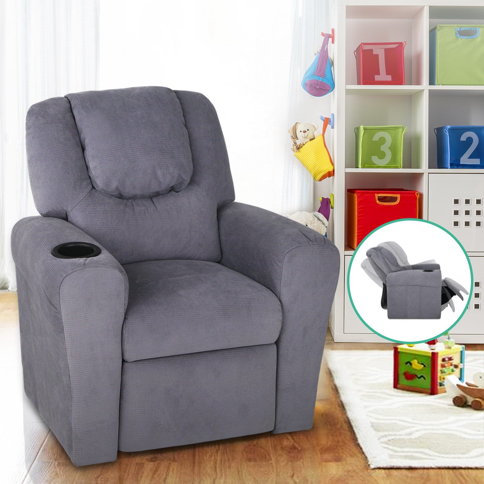 Light grey kids recliner with cup holder, toy shelf in background, inset showing chair in reclined position
