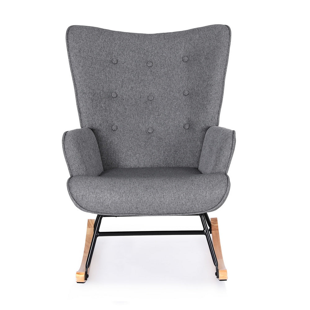 Grey linen rocking chair with tall button-tufted wingback and metal wood rocker base front view on white background