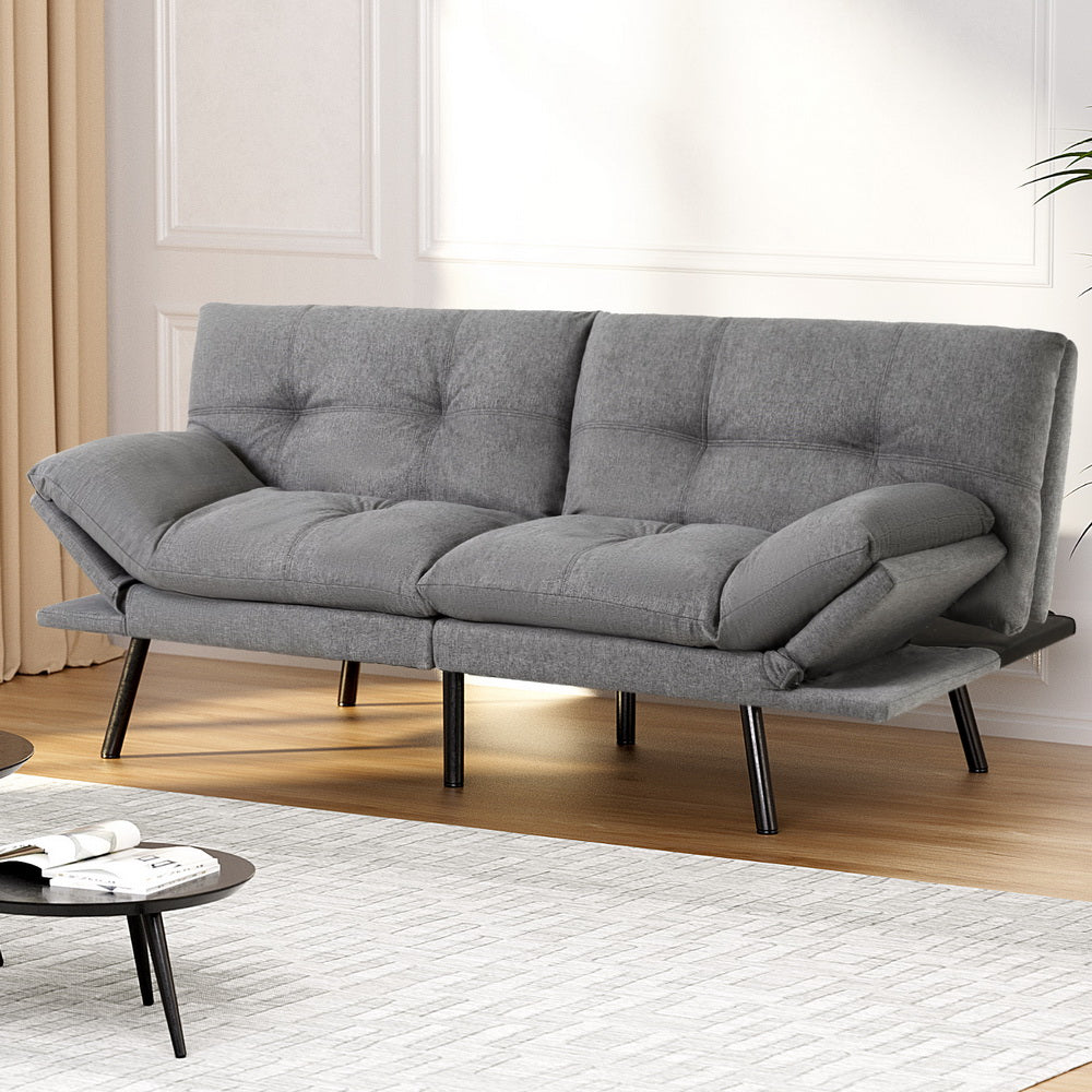 Grey linen sofa bed space-saving infographic showing three steps from closed sofa to fully extended pull-out bed
