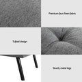 Dark grey linen sofa bed with trundle fully extended from left angle, back cushions flat, cup holders in armrests