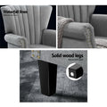 Three-panel detail of grey nailhead wingback: waterfall-stitched back, rolled nailhead arm, black leg with anti-scratch pad