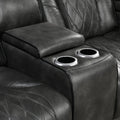 Close-up of grey leather recliner center console lid open with two silver cup holders visible