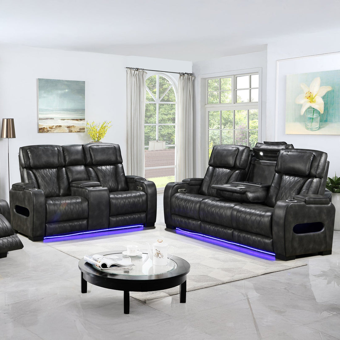 Dark charcoal leather power recliner sofa and loveseat set with blue LED lighting in bright living room