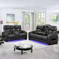 Dark charcoal leather power recliner sofa and loveseat set with blue LED lighting in bright living room