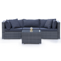 Grey rattan 3-seater outdoor lounge set with navy cushions and glass-top coffee table, lantern on table, white background