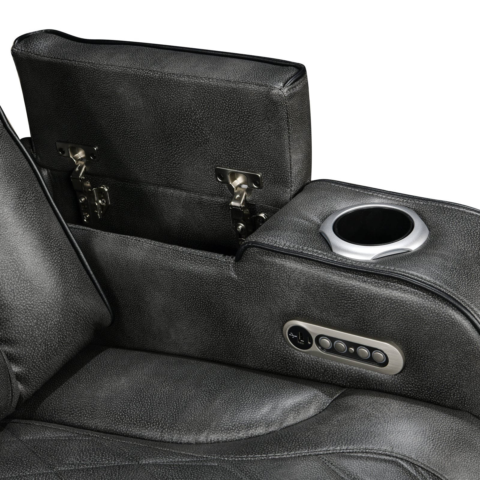 Close-up of dark grey leather recliner open storage tray with silver hinges and cup holder controls