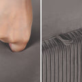 Two-panel close-up of grey velvet ottoman fabric: hand pressing into smooth top on left, ribbed pleated side texture on right
