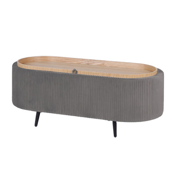 Oval storage ottoman with grey ribbed fabric, natural wood lid with handle and black tapered legs on white background