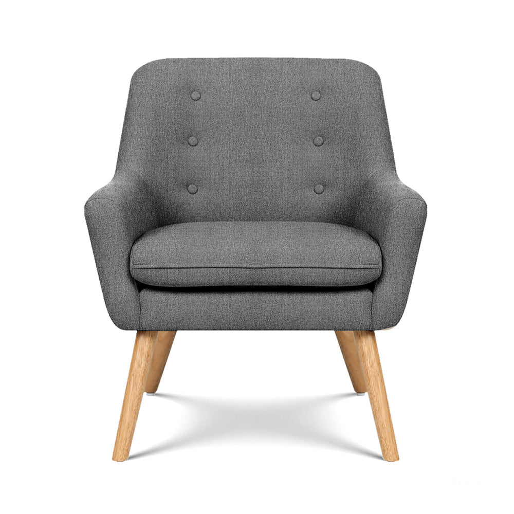 Dark grey button-tufted fabric armchair with six buttons on backrest, natural wood legs, front view on white background