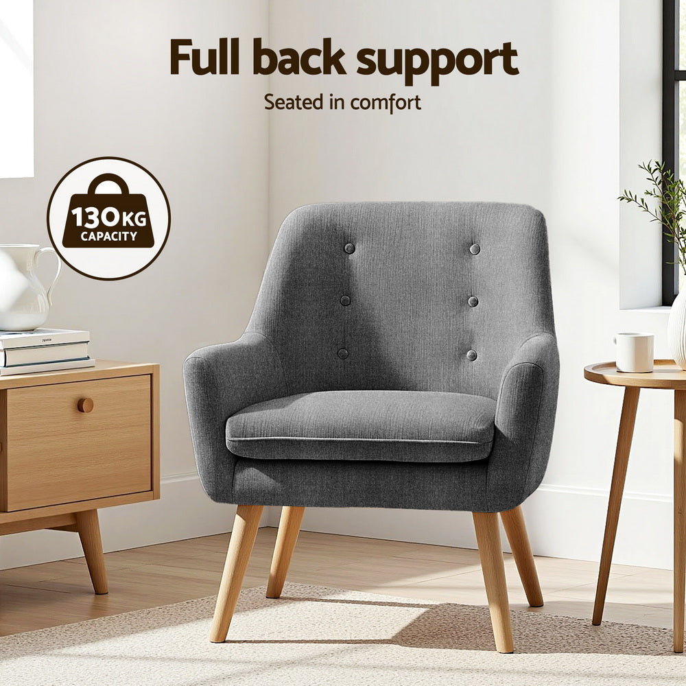 Dark grey tufted armchair in living room, 130kg capacity badge, "Full back support" text, oak cabinet and side table