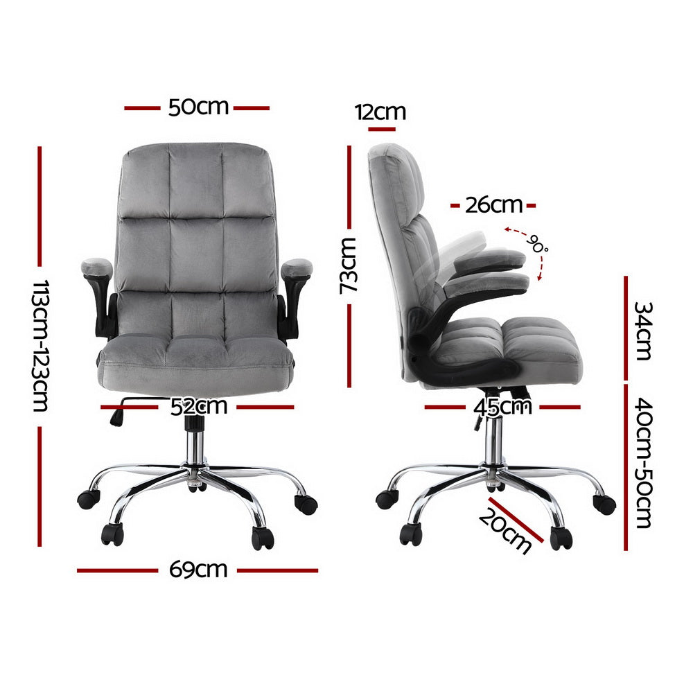Grey tufted velvet office chair with flip-up armrests and chrome base in modern office with plant and white desk