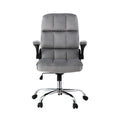 Grey tufted velvet high-back office chair front view with flip-up padded armrests and chrome five-star base on white