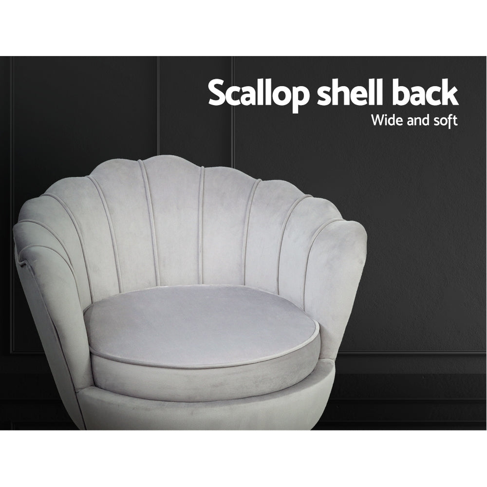 Grey velvet scallop chair close-up against dark background showing channel-stitched shell back with Scallop shell back text