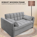Close-up of grey velvet sofa bed tufted seat cushion with Tufted Upholstery feature text overlay