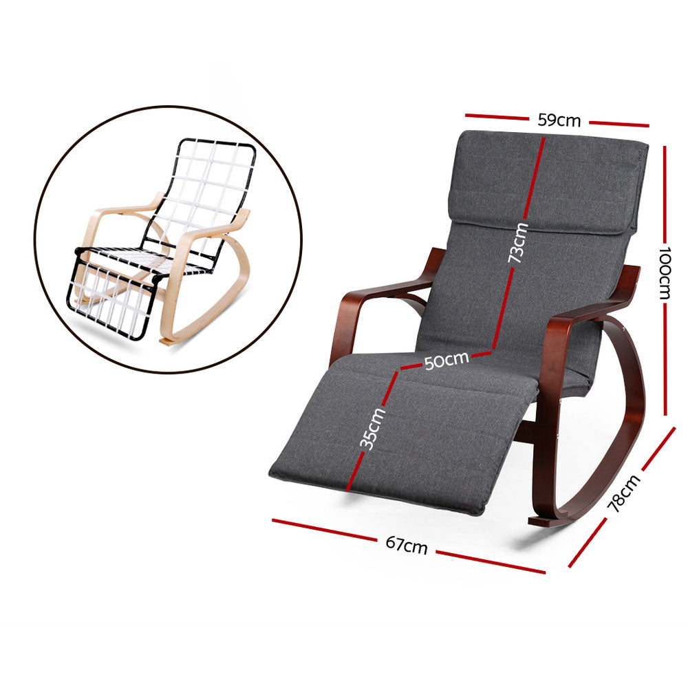 Dark grey fabric rocking recliner with walnut-finish bentwood frame and extended footrest, lifestyle room with palm plant