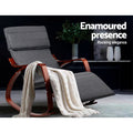 Grey fabric walnut-frame rocking recliner with cream throw in dark lifestyle room, text: Enamoured presence, Rocking elegance