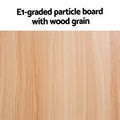 Close-up of light oak wood grain surface with text: E1-graded particle board with wood grain