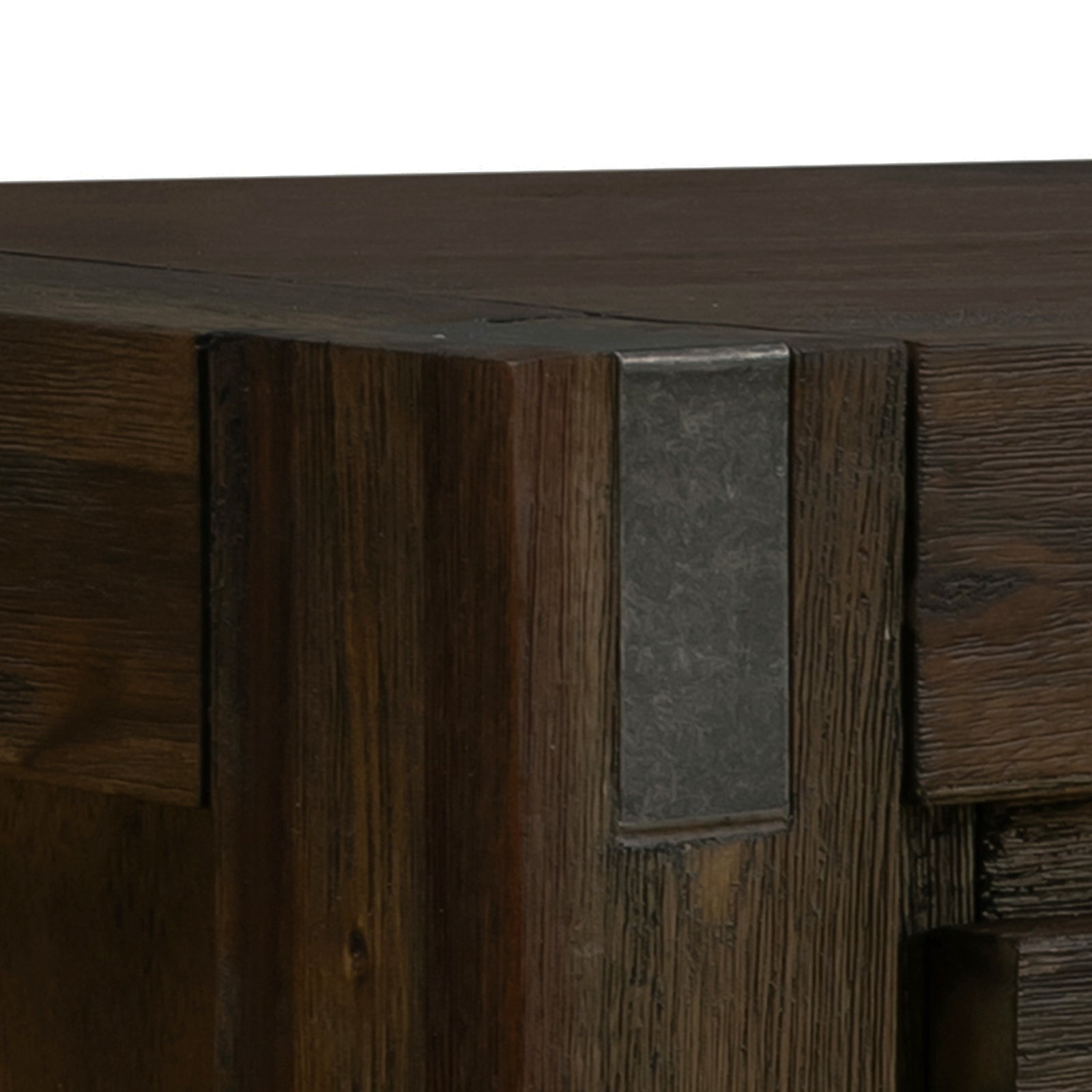 Extreme close-up of dark wood hall table corner showing chunky square leg and hammered metal corner bracket