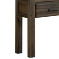 Close-up of dark charcoal wood hall table showing chunky square legs and structural side panel, drawer with handle visible