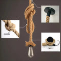 Hemp rope pendant lamp details: knotted rope with Edison bulb, black ceiling mount, Woven Rope inset, mounting hardware shown