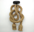 Hemp rope double pendant without bulbs, looped and knotted from black ceiling canopy, two frayed ends, white background