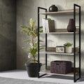 Industrial 4-tier open bookshelf with black metal frame and oak shelves styled with plant, books and wicker basket