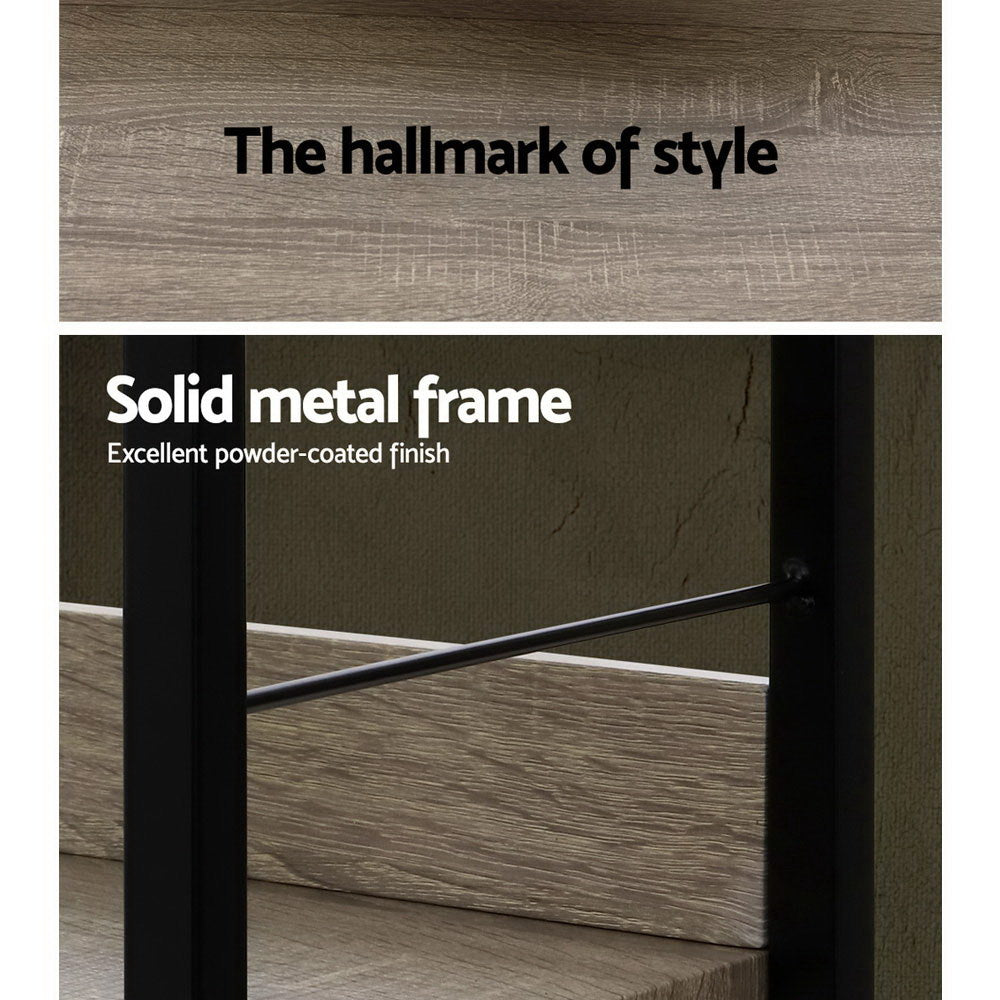 Close-up detail of industrial bookshelf showing grey oak shelf texture and black powder-coated metal frame cross brace